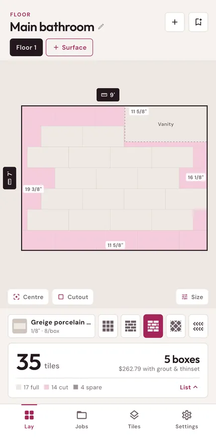 Tilecount layout of a bathroom floor with a vanity cutout: full tiles in cream, cut tiles in pink, the cut size at each wall